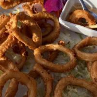 Calamari · Lightly battered squid, fried to a golden brown and served with sweet chili sauce.