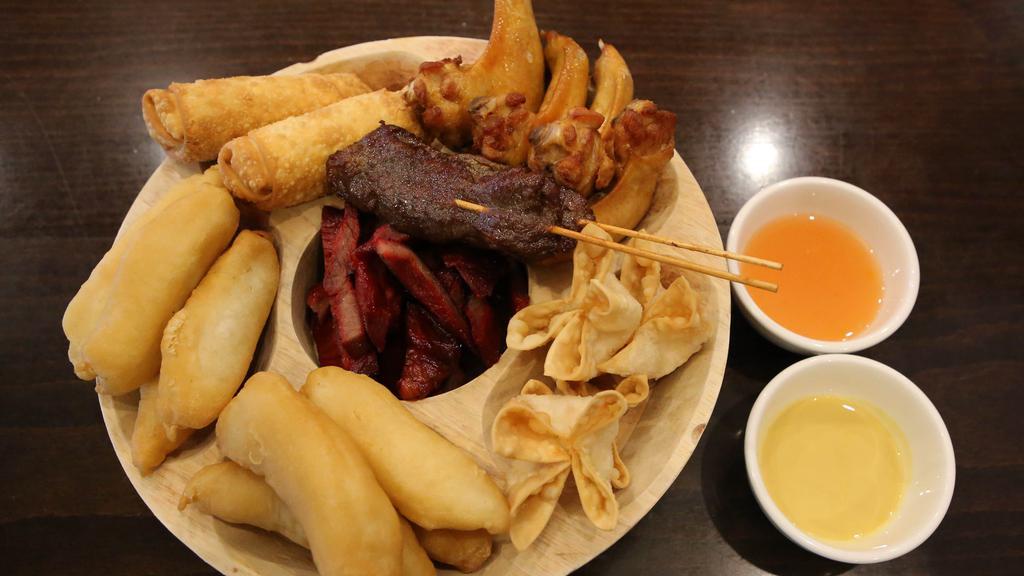 Pu Pu Platter For Two  / 二人宝A · Egg rolls, boneless spareribs, chicken fingers, chicken wings, beef teriyaki, and crab rangoon.