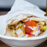 Chicken Shawarma · Includes rice pilaf, choice of side dip, choice of salad, and pita bread.