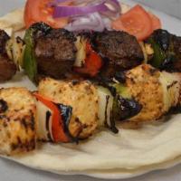 Chicken Kebab · Includes rice pilaf, choice of side dip, choice of salad, and pita bread.