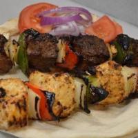 Lamb Kebab Skewer · Four chunks of domestic-fresh leg of lamb with peppers and onions.