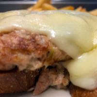 Tuna Melt · With tomato and swiss cheese. Served open faced on grilled rye bread.
