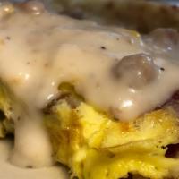 The Ranchers Omelette · Bacon, Ham, and Sausage Omelette topped with Sausage Gravy.