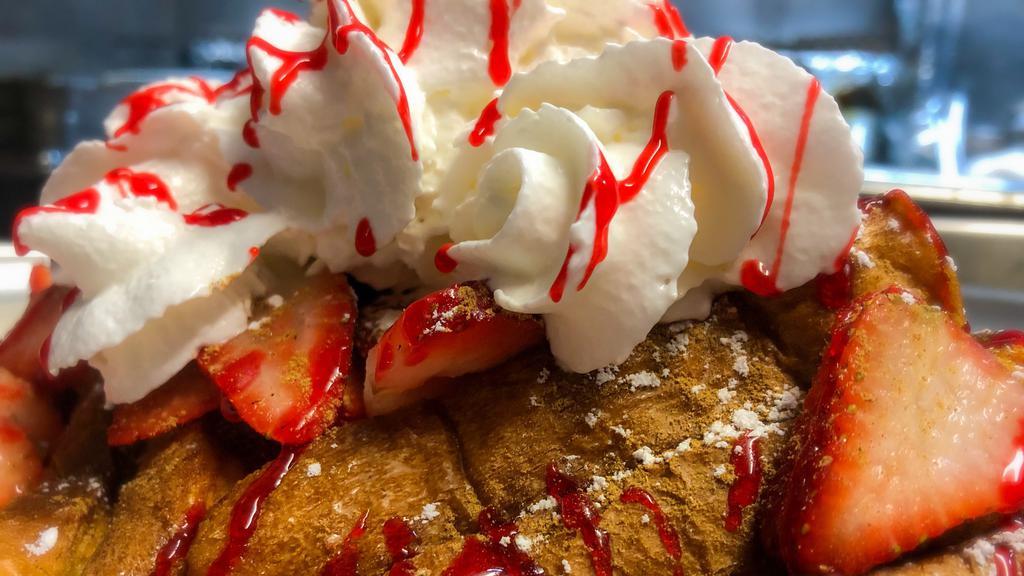 Strawberry Shortcake · Your choice of Waffle, French Toast, or Hot Cakes topped with Sliced Strawberries, Whipped Cream, and Strawberry Drizzle