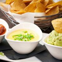 Trio Of Dips · Salsa, guacamole, and chili con queso. Served with tortilla chips.