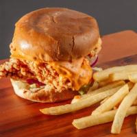 Crispy Chicken Burger · Lettuce, tomato, pickles, onions, chipotle aioli, American cheese.