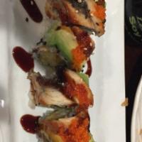 Dragon · Shrimp tempura, cucumber roll topped with eel, avocado, tobiko and eel sauce.