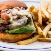 Gabi Burger · brie cheese, bacon lardons, garlic aioli, arugula, brioche bun, fries