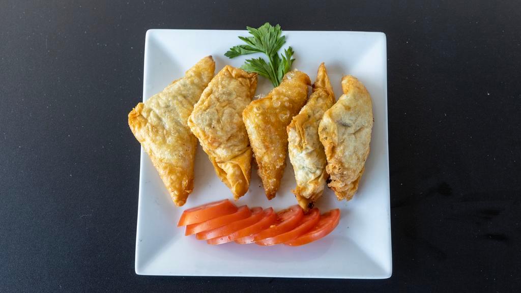 Spinach Pie · Thin filo dough filled with fresh spinach, feta cheese and parsley fried.