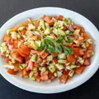 Shepherd Salad · Fresh tomatoes, cucumber, onions, parsley and dressing.