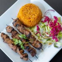 Lamb Shish Kebab · Marinated cubes of lamb on skewers. Served with bulqur, salad and homemade bread.