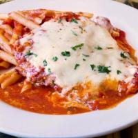 Chicken Parmigiana · Chicken cutlet baked with mozzarella cheese. Served with penne.