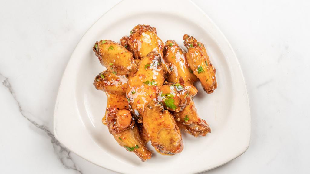 Chicken Wings · Buffalo, garlic parm or sweet chili.