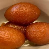 2 Gulab Jamun · Deep fried wheat and milk balls, soaked in syrup.