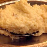 Kheer · Rice cooked in sweetened milk, raisins and almonds.