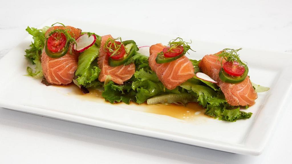 Salmon Carpaccio · Torched fresh seasoned raw salmon topped with jalapenos, tomatoes, and scallions.  Served with ponzu sauce and truffle oil.