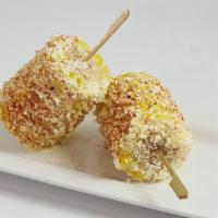 Yoki Street Corn · Corn on the cob glazed with garlic butter, mayonnaise and sprinkle with chili powder and che...