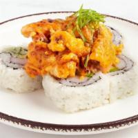 California Sunrise Maki · Jumbo California roll (crabstick, cucumber and avocado) topped with oven baked salmon, spicy...