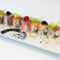 Patriots Maki · Escolar and cucumber roll topped with shisho leaf, tuna, salmon, and yellowtail.  Finished w...