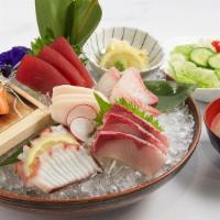 Sashimi Deluxe · Chef's choice of 17 pieces of assorted sashimi served with white rice or brown rice on the s...