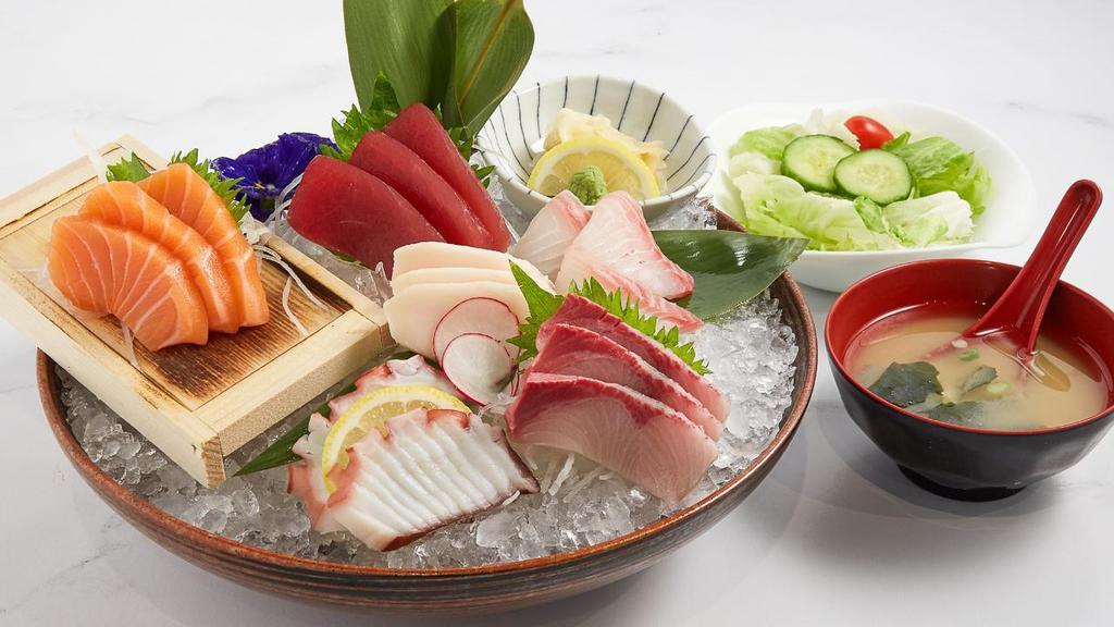 Sashimi Deluxe · Chef's choice of 17 pieces of assorted sashimi served with white rice or brown rice on the side.