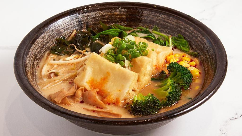 Tofu Ramen · Ramen noodles with tasty Miso broth, tofu, bamboo shoots, sweet corn, broccoli, seaweed, watercress and beansprout.