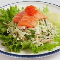 Avocado Salad · Avocado, crab stick and cucumber tossed in mayo and topped with fresh raw salmon and tobiko.