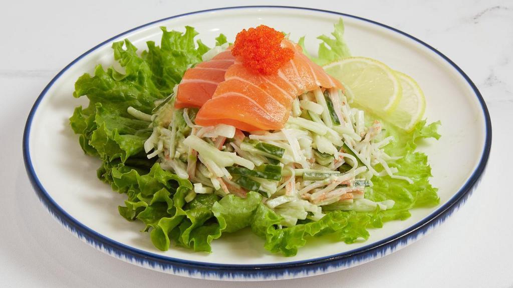 Avocado Salad · Avocado, crab stick and cucumber tossed in mayo and topped with fresh raw salmon and tobiko.