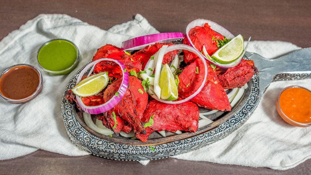 Tandoori Chicken Half · Marinated in distinctive herbs & spices and slowly cooked.