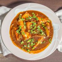 Chili Paneer Gravy · A popular fusion dish where cubes of paneer are cooked in a spicy sauce gravy.