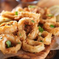 Fried Calamari · Lightly battered calamari fried to a golden crisp. Served with Marinara sauce.