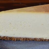 Cheesecake · Creamy, luscious cheesecake coated with traditional graham cracker crust.