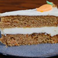 Layered Carrot Cake · Shredded carrots, blended in a spice layer cake iced with a rich cream cheese icing, decorat...