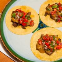 Steak Tacos · Roasted tomatillo-chipotle salsa and pico de gallo.