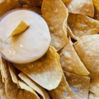 Chips & Queso · Corn Tortilla chips + house made Queso Sauce