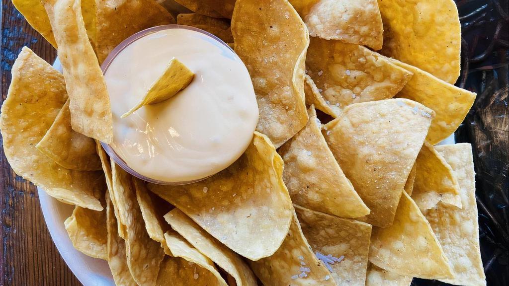 Chips & Queso · Corn Tortilla chips + house made Queso Sauce
