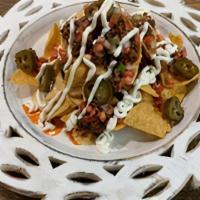 Nachos (Spicy Beef+Jalapenos+Pico+Sour Cream) · Corn Tortilla chips with queso +  protein of your choice + jalapenos + pico de galo + sour c...