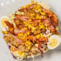Cobb Salad · Garden salad w/ chicken, hard-boiled egg, bacon, roasted corn, mozzarella cheese.