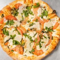 Tomato Basil Garlic Pizza · No sauce, olive oil, fresh mozzarella, garlic, basil, fresh tomatoes.