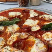 Margherita Pizza · Tomato Sauce, fresh Mozzarella, basil, shaved parmesan