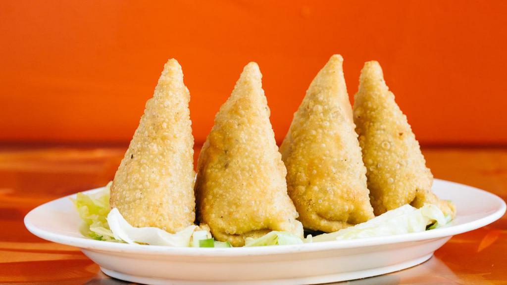 Vegetable Samosa (2 Pieces) · Crisp deep fried pies stuffed with potatoes and green peas.