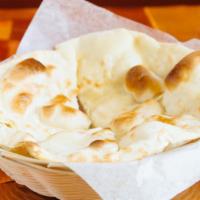 Butter Naan · Heaven white flour baked bread in a clay oven, served hot.