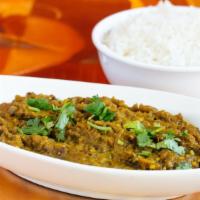 Baigan Bharta · Oven roasted eggplant mashed and finished with onions, tomatoes, peas and spices.