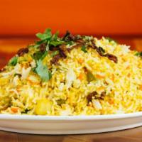 Vegetable Biryani · Indian basmati rice cooked with mixed vegetables, cashew nuts and raisins.