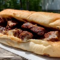 Doms Steak Tip Sub · Dom's famous steak tips with American cheese on a sub roll.