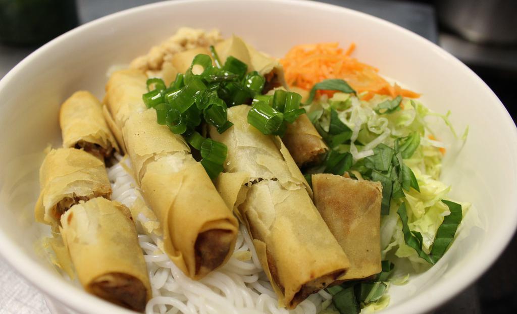Spring Rolls Vermicelli · Crispy spring rolls with finely ground pork, onion and mushrooms on vermicelli. Topped with crush peanuts.