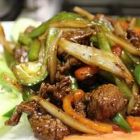 Country Style Beef · Stir-fried filet mignon with bell pepper and onion. Served sizzling with steamed Jasmine ric...
