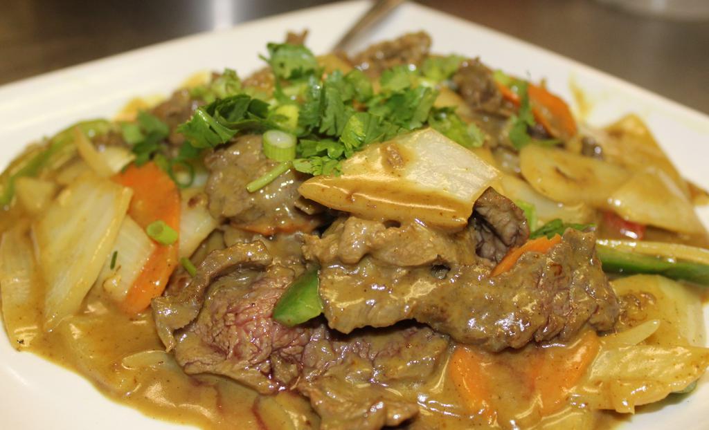 Beef Curry · Spicy. Sautéed sliced flank steak with bell peppers, onions, Vietnamese coconut curry sauce. Served sizzling with steamed jasmine rice or vermicelli.
