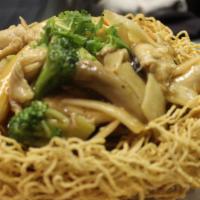Chicken Crispy Egg Noodle · Sautéed white meat chicken with mixed vegetables in garlic sauce over crispy egg noodle.