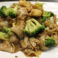 Pad Se Lew · Wide rice noodles, eggs and broccoli pan fried in a sweet soy sauce combined with our specia...